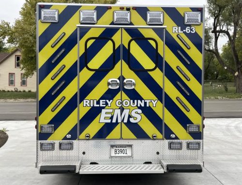 Woman hospitalized after being hit by truck