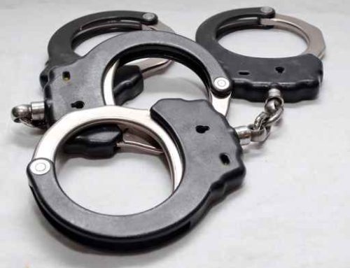 Teen arrested after damaging building window
